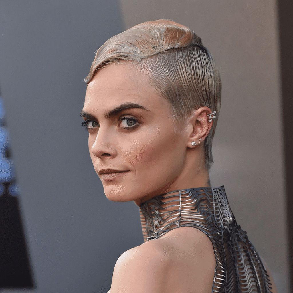 Cara Delevingne showing off edgy industrial bars and silver helix piercings