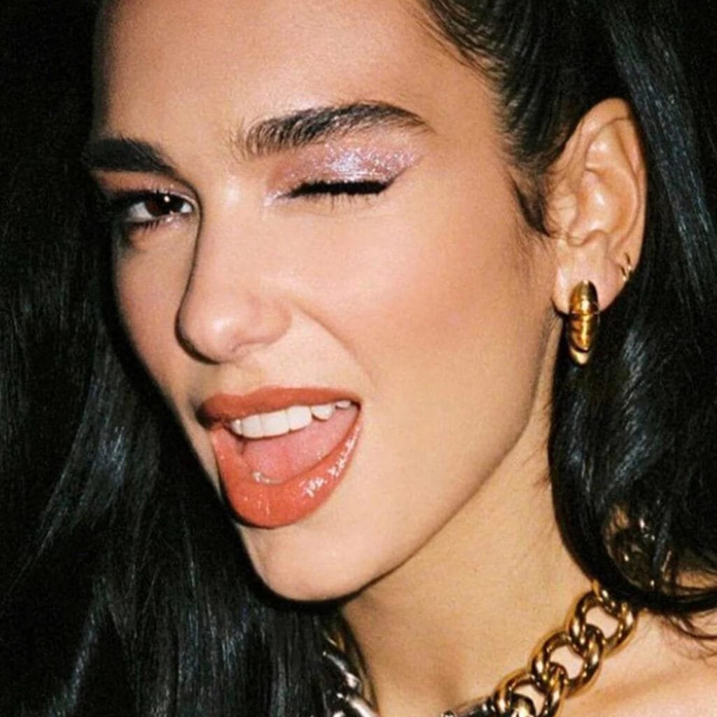 Dua Lipa conch piercing with bold hoop earring