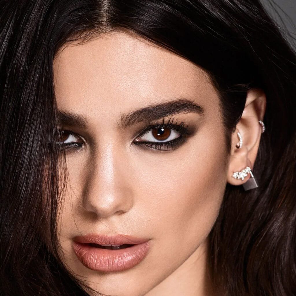 Dua Lipa tragus piercing featuring a delicate stud