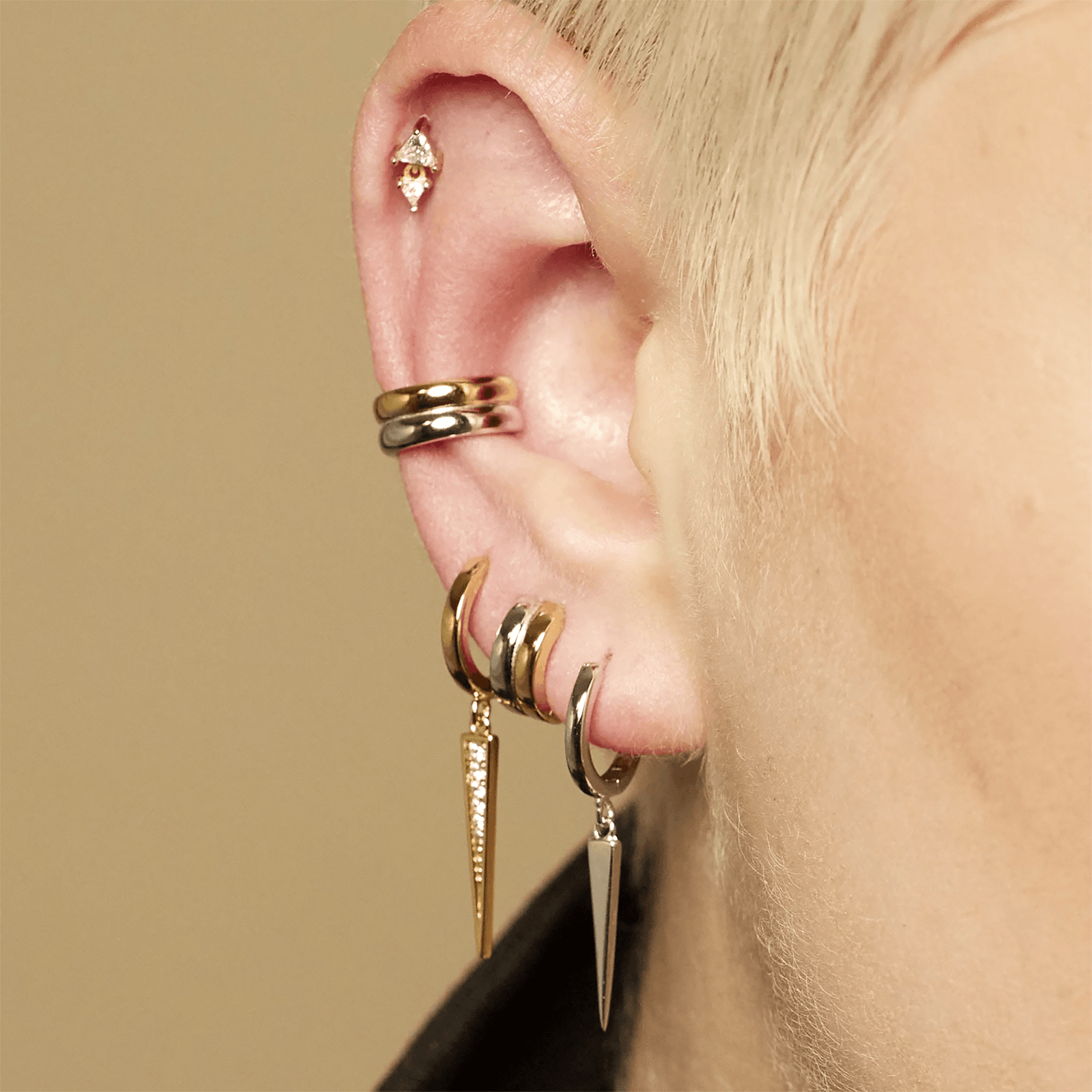 Ear curation with tiny gold studs and a single hoop for a balanced minimalist look