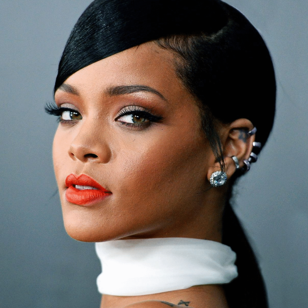 Rihanna Ear Piercings featuring elegant gold helix hoops