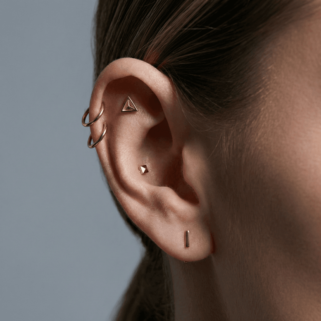 Cartilage focused curated ear with flat double helix and conch piercings