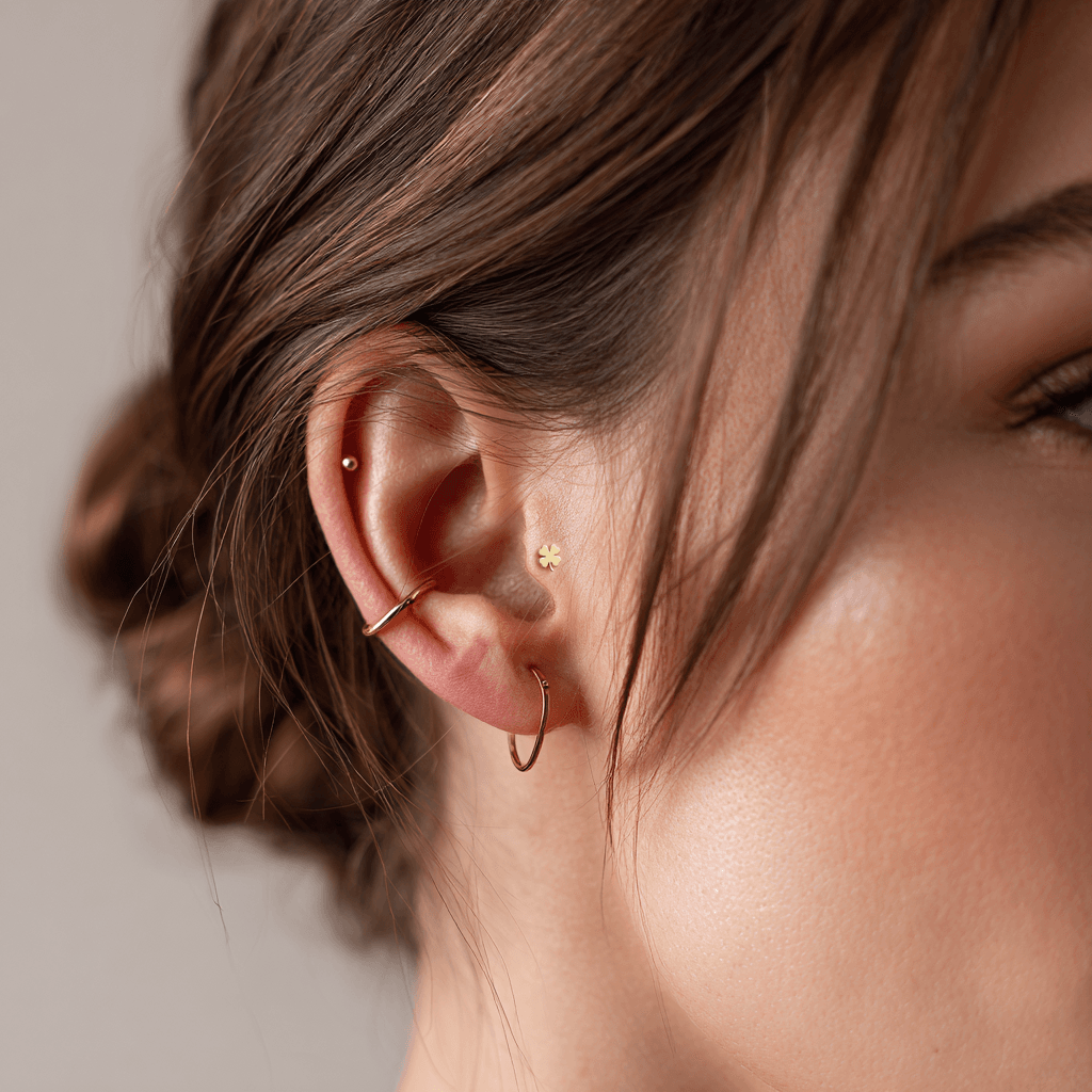 Minimal curated ear with double lobe studs and thin gold helix hoop
