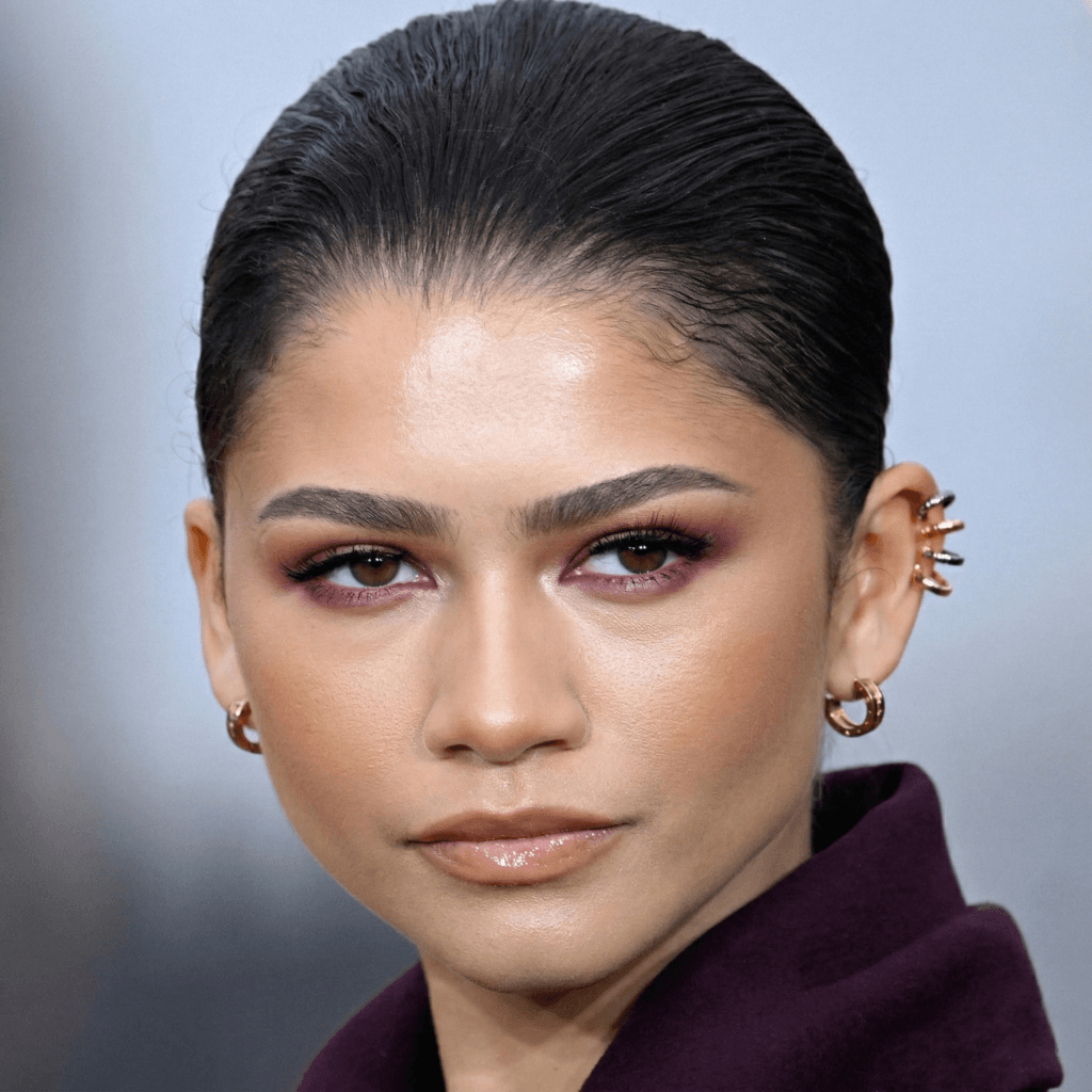 Zendaya curated ear stack featuring lobe and helix piercings in gold